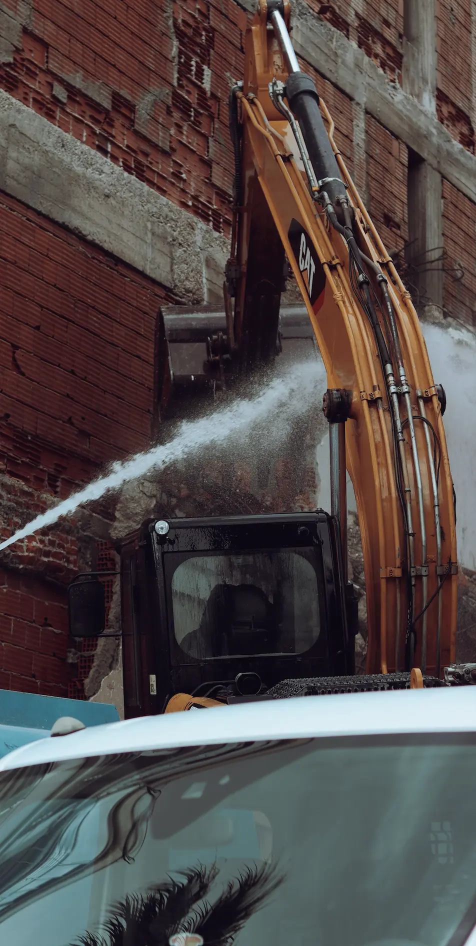 Illustrative photograph: demolition machinery and concrete rubble
